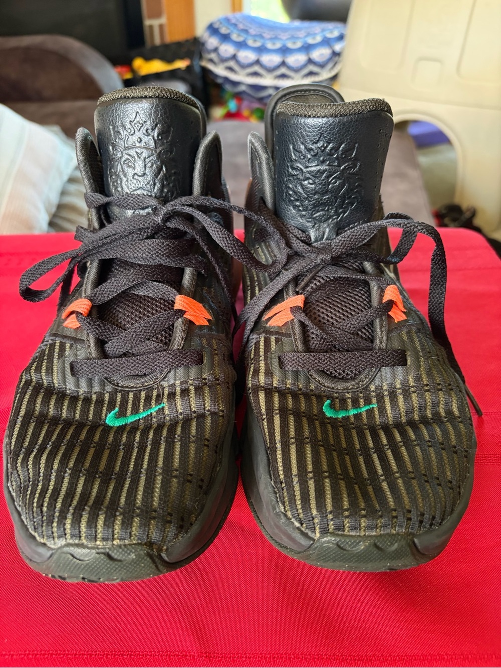 Nike men’s Black Sneakers with Teal Swoosh and Orange Lace Loops